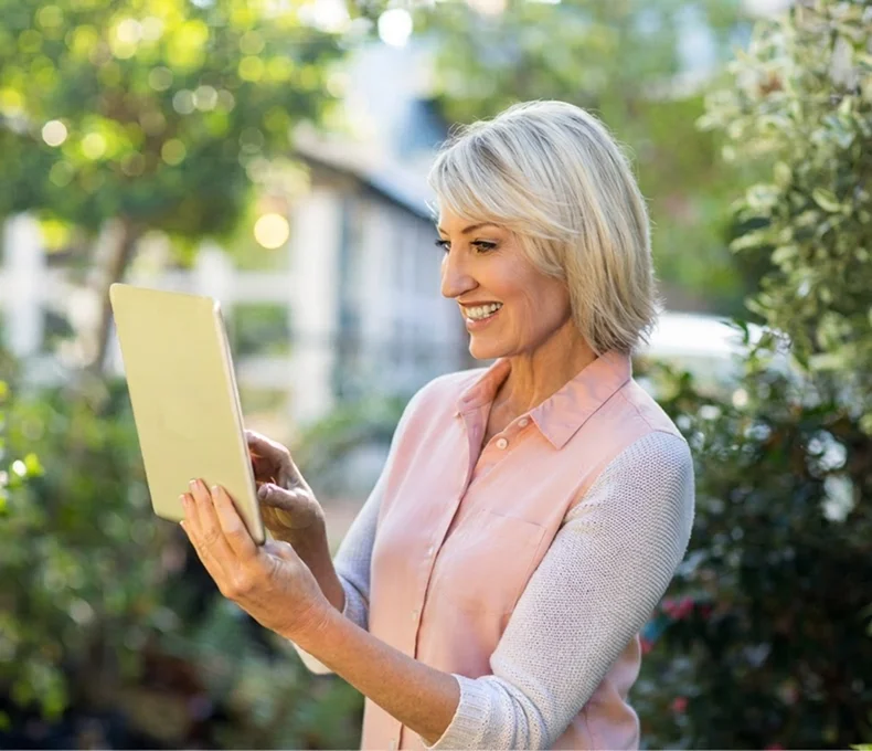 Woman using a tablet outdoors