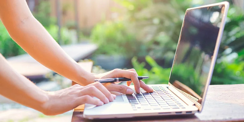 Person working on a laptop outdoors